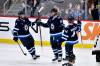 Winnipeg Jets left wing Kyle Connor (81) celebrates his goal against the Arizona Coyotes with teammates Alex Iafallo (9) and Josh Morrissey (44) during first period NHL action in Winnipeg on Sunday February 25, 2024. (Fred Greenslade / The Canadian Press)