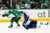 Dallas Stars defenceman Nils Lundkvist chases the puck after getting past Winnipeg Jets centre Adam Lowry in the second period in Dallas, Thursday. (AP Photo/Tony Gutierrez)