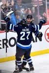 Winnipeg Jets' Alex Iafallo (9) celebrates his goal against the St. Louis Blues with Nikolaj Ehlers (27) during the third period of NHL action in Winnipeg on Tuesday February 27, 2024. THE CANADIAN PRESS/Fred Greenslade
