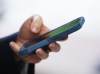 A person uses a cell phone in Ottawa on Monday, July 18, 2022. As April 1 approaches, consumers would be wise to extend some additional skepticism, with experts saying artificial intelligence ramps up the potential for sophisticated promotional ploys. THE CANADIAN PRESS/Sean Kilpatrick