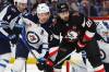 Winnipeg Jets defenceman Josh Morrissey (44) and Buffalo Sabres right wing Alex Tuch (89) battle for position in front of the net during the first period on Sunday. (Jeffrey T. Barnes / The Associated Press)