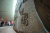 RUTH BONNEVILLE / FREE PRESS
                                The late Bruce Head&rsquo;s signature adorns The Wall, the massive career-defining concrete artwork he created for the underground concourse at Portage and Main.
