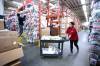 Ruth Bonneville / Free Press
                                Workers handle stock in West Coast Kids&rsquo; 40,000-sq.-ft. warehouse near Winnipeg&rsquo;s airport.
