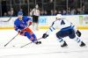 New York Rangers center Jack Roslovic (96) skates against Winnipeg Jets defenseman Neal Pionk (4) during the second period of an NHL hockey game, Tuesday, March 19, 2024, at Madison Square Garden in New York. (AP Photo/Mary Altaffer)