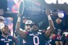 Montreal Alouettes defensive end Shawn Lemon (0) hoists the Grey Cup as the Alouettes celebrate defeating the Winnipeg Blue Bombers in the 110th CFL Grey Cup in Hamilton, Ont., on Sunday, November 19, 2023. Lemon, who won three Grey Cups with three different organizations, announced his retirement from the Canadian Football League on Wednesday. THE CANADIAN PRESS/Frank Gunn