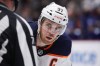 Edmonton Oilers' Connor McDavid lines up for a faceoff against the Vancouver Canucks during the third period of an NHL hockey game in Vancouver, on Tuesday, January 25, 2022. THE CANADIAN PRESS/Darryl Dyck