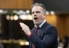 Health Minister Mark Holland rises during Question Period on April 16, 2024 in Ottawa. &nbsp;THE CANADIAN PRESS/Adrian Wyld