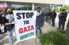 Pro-Palestinian protesters protest as Detroit Police look on during a visit by Vice President Kamala Harris in Detroit, Monday, May 6, 2024. (AP Photo/Paul Sancya)