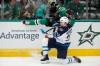 Tony Gutierrez / The Associated Press
                                Jets centre Sean Monahan takes out the Stars&rsquo; Jamie Benn on Thursday in Dallas.