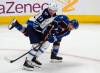 David Zalubowski / The Associated Press
                                Jets forward Tyler Toffoli checks Avalanche defenceman Devon Toews on Sunday in Denver.