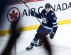 Winnipeg Jets' Gabriel Vilardi (13) celebrates his empty net goal against the Calgary Flames during third period NHL action in Winnipeg on Thursday, April 4, 2024. THE CANADIAN PRESS/John Woods