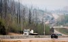 Traffic moves along Highway 63 as wildfire smoke hangs in air in Fort McMurray, Alta., on Wednesday, May 15, 2024. THE CANADIAN PRESS/Jeff McIntosh