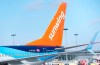 A Sunwing aircraft is parked at Montreal Trudeau Airport in Montreal on Wednesday, March 2, 2022. THE CANADIAN PRESS/Paul Chiasson
