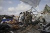 Displaced Palestinians inspect their tents destroyed by Israel's bombardment, adjunct to an UNRWA facility west of Rafah city, Gaza Strip, Tuesday, May 28, 2024. (AP Photo/Jehad Alshrafi)