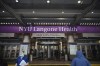 FILE - Health care workers walk in and out of the entrance at NYU-Langone Hospital on Monday, Dec. 14, 2020, in New York. A nurse was fired by the hospital after she referred to Israel's war in Gaza as 
