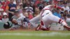 Detroit Tigers' Wenceel Perez, left, scores on a sacrifice fly by Gio Urshela as Boston Red Sox catcher Reese McGuire, right, tries to tag him in the sixth inning of a baseball game, Sunday, June 2, 2024, in Boston. (AP Photo/Steven Senne)