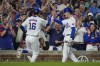 Chicago Cubs' Patrick Wisdom, left, is greeted by Pete Crow-Armstrong after Wisdom's two-run home run against the Chicago White Sox during the sixth inning of a baseball game Tuesday, June 4, 2024, in Chicago. (AP Photo/Erin Hooley)