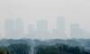 JOHN WOODS / FREE PRESS Significant smoke from a blaze near Flin Flon and carried south by heavy winds blanketed large swaths of the province &mdash; including Winnipeg &mdash; on Sunday.