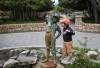 Ruth Bonneville / Free Press
                                Jackson Grusko, age three, gets a closer look at the Boy with the Boot statue at the entrance to the Assiniboine Park&rsquo;s English Garden Monday. The statue is one of several structures that are being considered for heritage status.