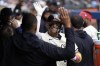 Minnesota Twins' Royce Lewis, back, center, celebrates in the dugout after hitting a two-run home run during the sixth inning of a baseball game against the Colorado Rockies, Wednesday, June 12, 2024, in Minneapolis. (AP Photo/Abbie Parr)