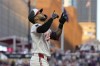 Minnesota Twins' Carlos Correa gestures while crossing home plate after hitting a two-run home run against the Oakland Athletics during the seventh inning of a baseball game Thursday, June 13, 2024, in Minneapolis. (AP Photo/Abbie Parr)