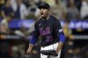 New York Mets' Edwin Diaz reacts after the final out during the ninth inning of a baseball game against the San Diego Padres, Friday, June 14, 2024, in New York. (AP Photo/Adam Hunger)