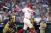 Philadelphia Phillies' Kyle Schwarber follows through after hitting a two-run home run against San Diego Padres pitcher Adrian Morejon during the sixth inning of a baseball game, Monday, June 17, 2024, in Philadelphia. (AP Photo/Matt Slocum)