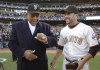 FILE - San Francisco Giants Hall of Famer Willie Mays, left, looks over his 2010 World Series championship ring that was presented to him by Giants center fielder Andres Torres, right, before their baseball game against the St. Louis Cardinals in San Francisco, Saturday, April, 9, 2011. Willie Mays, the electrifying “Say Hey Kid” whose singular combination of talent, drive and exuberance made him one of baseball’s greatest and most beloved players, has died. He was 93. Mays' family and the San Francisco Giants jointly announced Tuesday night, June 18, 2024, he had died earlier in the afternoon in the Bay Area. (AP Photo/Eric Risberg, Pool, File)