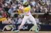 San Diego Padres' Fernando Tatis Jr. is hit by a pitch during the third inning of a baseball game against the Milwaukee Brewers, Friday, June 21, 2024, in San Diego. (AP Photo/Gregory Bull)