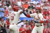 St. Louis Cardinals' Brendan Donovan, right, is congratulated by teammate Matt Carpenter (13) after hitting a solo home run in the seventh inning of a baseball game against the San Francisco Giants, Saturday June 22, 2024, in St. Louis. (AP Photo/Joe Puetz)