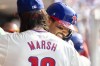 Philadelphia Phillies' Nick Castellanos, right, is congratulated by Brandon Marsh, left, after hitting a two-run home run during the fifth inning of a baseball game against the Arizona Diamondbacks, Saturday, June 22, 2024, in Philadelphia. (AP Photo/Laurence Kesterson)