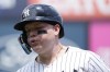 New York Yankees' Alex Verdugo runs into the dugout at the bottom of the first inning after grounding out to Atlanta Braves first baseman Matt Olson during a baseball game, Sunday, June 23, 2024, in New York. (AP Photo/Pamela Smith)