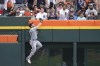 Chicago White Sox leftfielder Andrew Benintendi cannot reach a Detroit Tigers' Riley Greene home run in the second inning of a baseball game, Sunday, June 23, 2024, in Detroit. (AP Photo/Paul Sancya)
