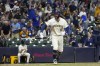 Milwaukee Brewers' Rhys Hoskins reacts after hitting a grand slam during the sixth inning of a baseball game against the Texas Rangers Monday, June 24, 2024, in Milwaukee. (AP Photo/Morry Gash)