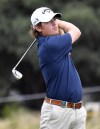 FILE - Netherlands Darius van Driel watches his approach shot into the 18th green during his match at the World Cup of Golf at Kingston Heath in Melbourne, Australia, Friday, Nov. 25, 2016. Dutch officials are not sending Van Driel to the Olympics because they feel his world ranking is too low to have a chance. (AP Photo/Andrew Brownbill, File)