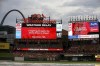 The infield is covered with a tarp before a scheduled baseball game between the St. Louis Cardinals and the Atlanta Braves on Tuesday, June 25, 2024. The game was later postponed to Wednesday, (AP Photo/Scott Kane)