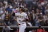 San Diego Padres' Manny Machado celebrates after hitting a two-run home run during the first inning of a baseball game against the Washington Nationals, Tuesday, June 25, 2024, in San Diego. (AP Photo/Gregory Bull)