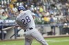 Texas Rangers' Jonah Heim hits a single during the eighth inning of a baseball game against the Milwaukee Brewers Tuesday, June 25, 2024, in Milwaukee. (AP Photo/Morry Gash)