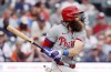 Philadelphia Phillies' Brandon Marsh singles against the Detroit Tigers to drive in Bryson Stott and Nick Castellanos during the fifth inning of a baseball game Wednesday, June 26, 2024, in Detroit. (AP Photo/Duane Burleson)