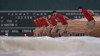 The grounds crew drags the tarp across the infield of Fenway Park during a downpour in the second inning of a baseball game between the Boston Red Sox and Toronto Blue Jays at Fenway Park, Wednesday, June 26, 2024, in Boston. (AP Photo/Charles Krupa)