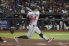 Minnesota Twins' Jose Miranda hits a three run double against the Arizona Diamondbacks in the second inning during a baseball game, Wednesday, June 26, 2024, in Phoenix. (AP Photo/Rick Scuteri)