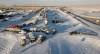 A truck convoy of anti-COVID-19 vaccine mandate demonstrators block the highway at the busy U.S. border crossing in Coutts, Alta., Wednesday, Feb. 2, 2022. THE CANADIAN PRESS/Jeff McIntosh