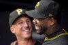 Pittsburgh Pirates pitcher Aroldis Chapman (45) celebrates in the dugout after to striking out Atlanta Braves' Sean Murphy in the nineth inning of a baseball game, Saturday, June 29, 2024, in Atlanta. Chapman struck out Braves' Sean Murphy, passing Billy Wagner for the most career strikeouts by a left-handed reliever with 1.197. (AP Photo/Mike Stewart)