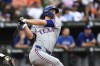 Texas Rangers' Corey Seager watches his solo home run off Baltimore Orioles pitcher Cade Povich during the first inning of a baseball game, Saturday, June 29, 2024, in Baltimore. (AP Photo/Terrance Williams)