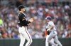 Baltimore Orioles pitcher Cade Povich, left, looks on after surrendering a solo home run to Texas Rangers' Corey Seage, right,r during the first inning of a baseball game, Saturday, June 29, 2024, in Baltimore. (AP Photo/Terrance Williams)