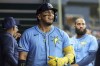 Tampa Bay Rays' Isaac Paredes, center, celebrates after his home run against the Washington Nationals during the second inning of a baseball game Sunday, June 30, 2024, in St. Petersburg, Fla. (AP Photo/Mike Carlson)