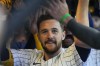 Milwaukee Brewers' Brice Turang is congratulated after hitting a grand slam during the fourth inning of a baseball game against the Chicago Cubs Sunday, June 30, 2024, in Milwaukee. (AP Photo/Morry Gash)