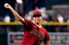 FILE - Arizona Diamondbacks' first-round draft pick Druw Jones throws out the first pitch prior to the team's baseball game against the Washington Nationals on Saturday, July 23, 2022, in Phoenix. The last two No. 2 overall Major League Baseball draft picks will play for the National League in the All-Star Futures Game featuring top prospects. Washington's Dylan Crews, the second pick in 2023, and Arizona's Druw Jones (2022) headline a group that includes a dozen former first-round selections on both the National League and American League rosters. The teams were announced on Tuesday, July 2, 2024. (AP Photo/Ross D. Franklin, File)