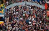 Alberta Premier Danielle Smith and NDP Leader Naheed Nenshi are aiming to flip pancakes, and a few votes, at this summer's Calgary Stampede. Crowds at the Stampede parade in Calgary, Sunday, July 9, 2023. THE CANADIAN PRESS/Jeff McIntosh