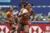 FILE - Australia's Charlotte Caslick runs to score a try against Fiji during the second day of the Hong Kong Sevens rugby tournament in Hong Kong, Saturday, April 1, 2023. Caslick will lead Australia's world series champion squad to the Paris Olympics, where she's aiming to win her second gold medal after taking the honors when rugby sevens made its debut at the Summer Games in 2016. (AP Photo/Anthony Kwan, File)
